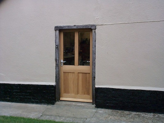 Stained oak half glazed door